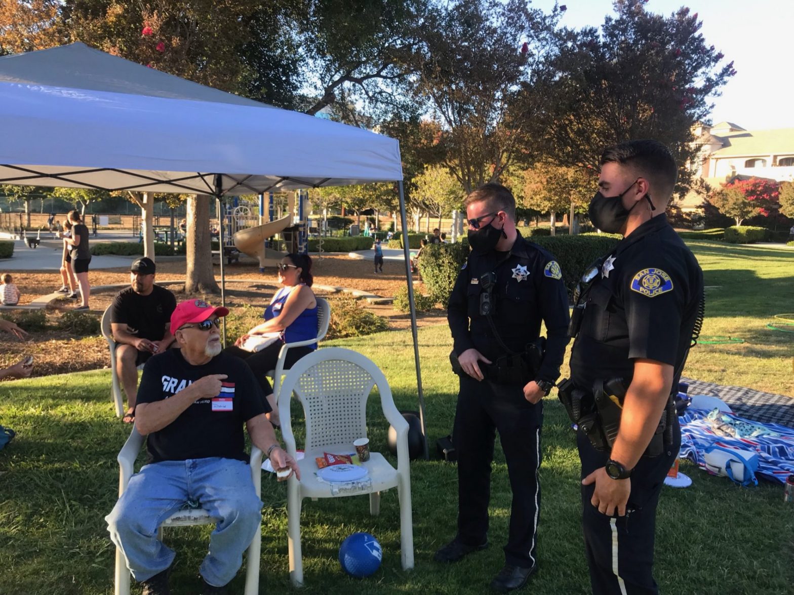 San Jose Police officers talking with a resident at National Night Out